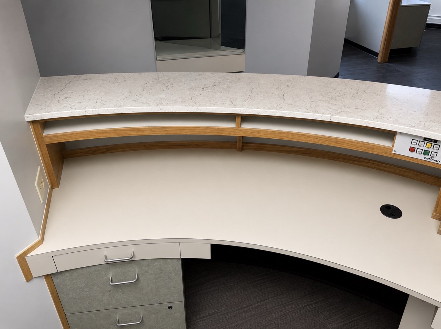 Back of the curved quartz reception counter with a 2 cm top and eased edge