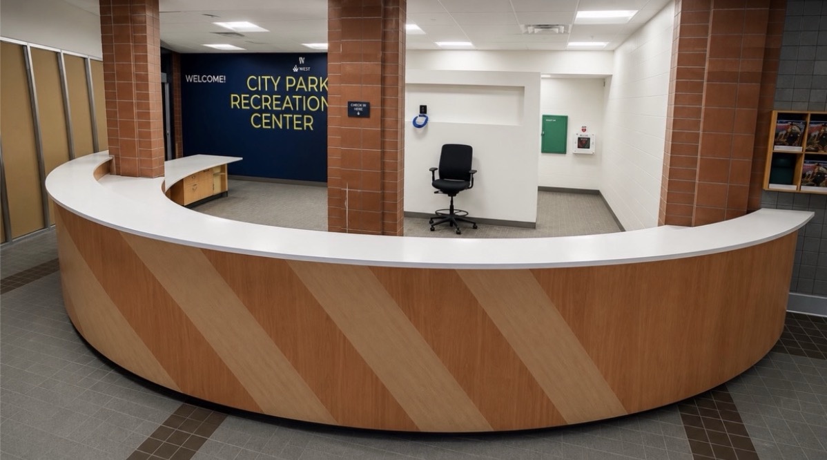 Commercial curved quartz reception counters with 3 cm square eased edges, view 1