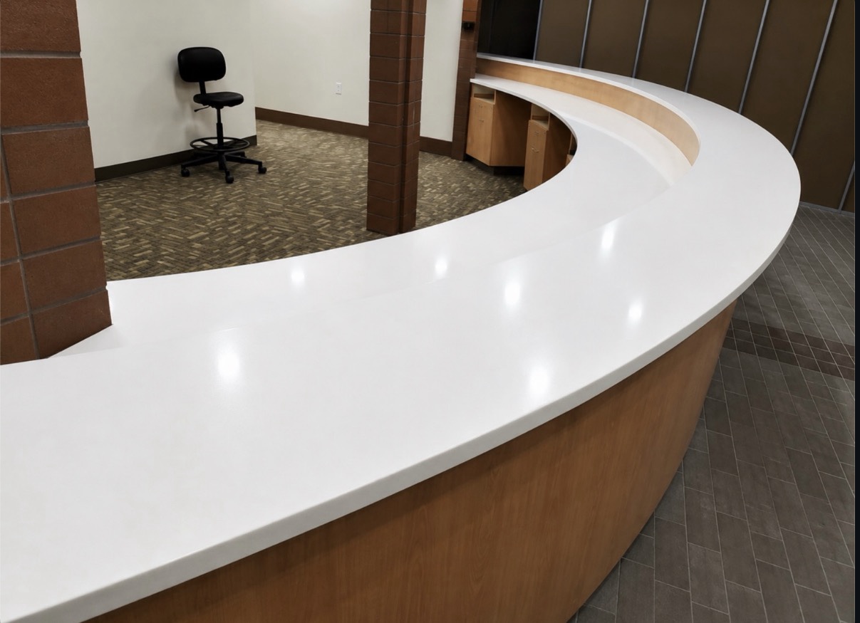 Commercial curved quartz reception counters with 3 cm square eased edges, view 2